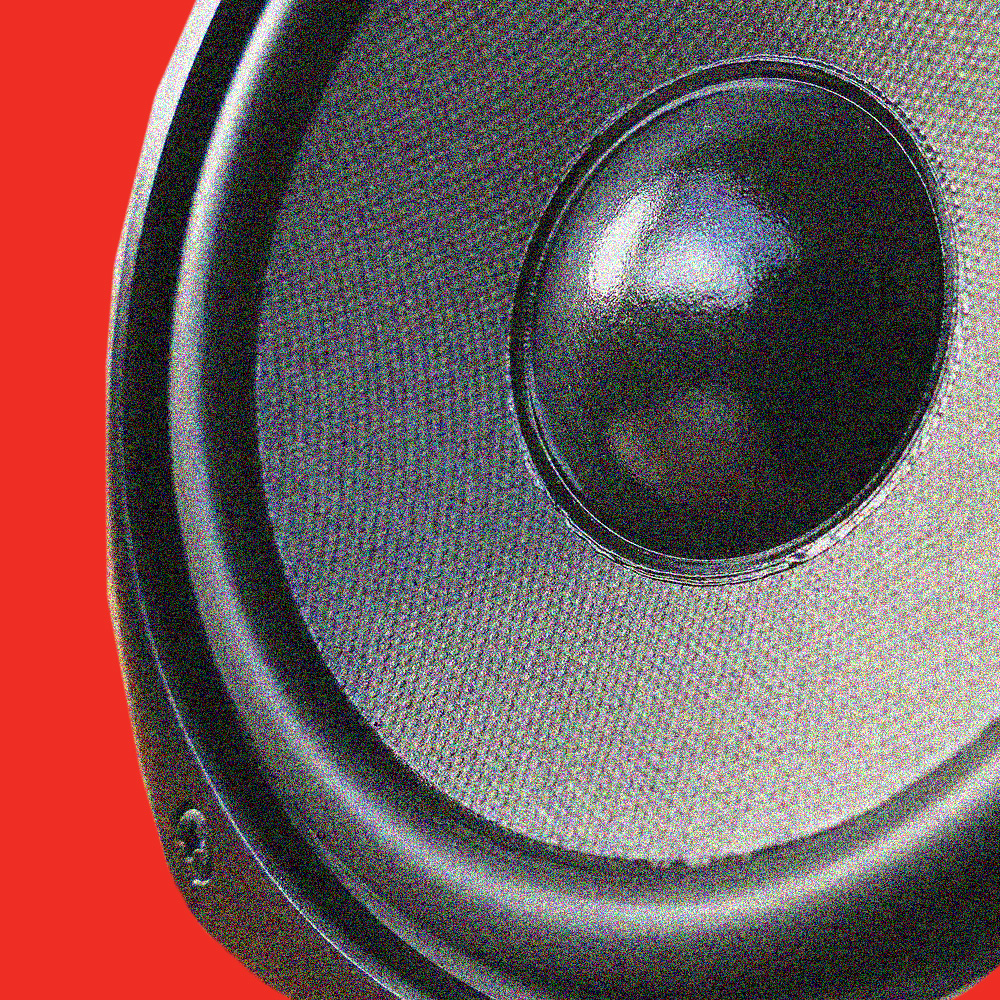 Speaker is photoshopped on top of a red background